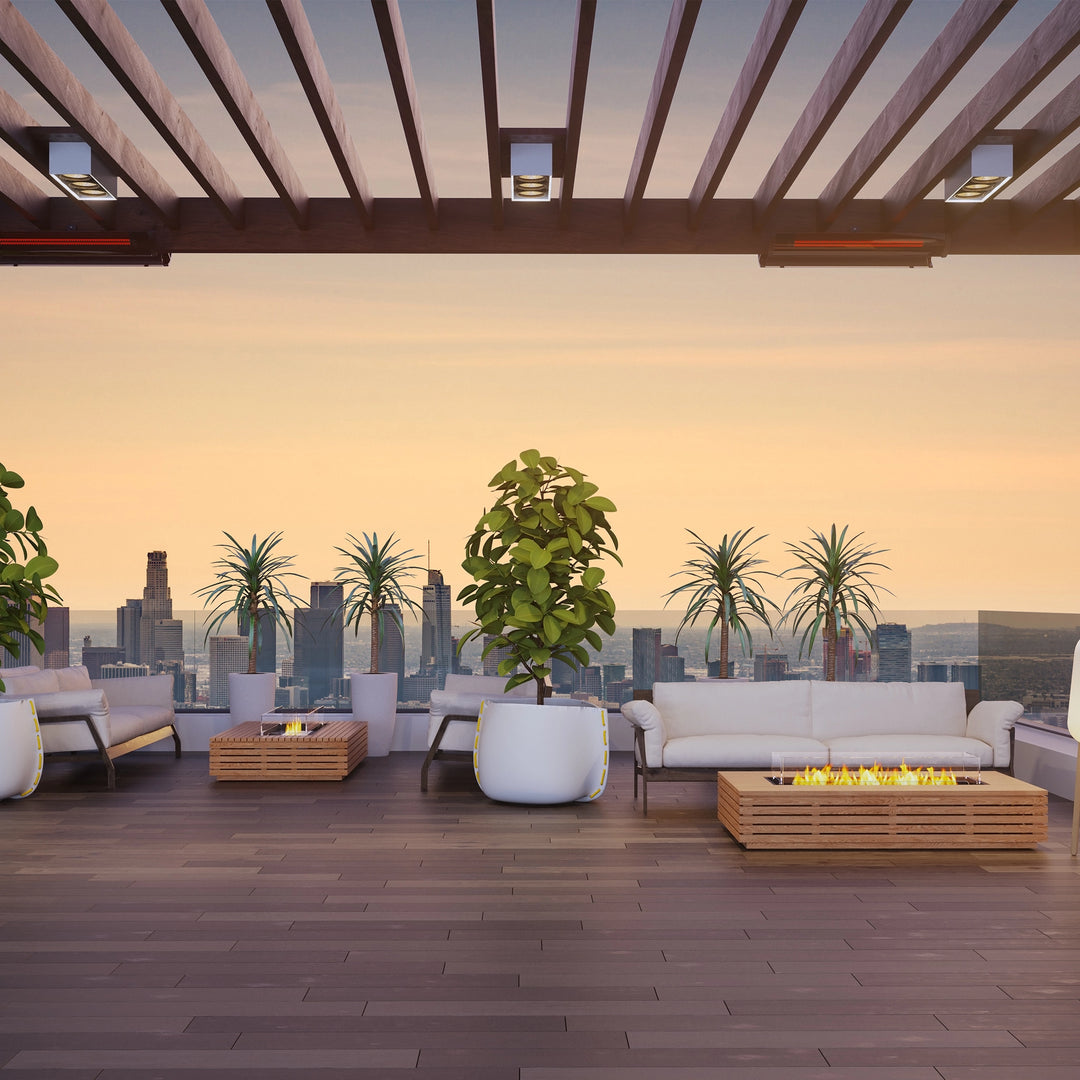 An upscale urban terrace with panoramic city views, featuring two EcoSmart Fire Wharf 50 fire pits in natural teak. Positioned alongside contemporary lounge seating, these luxury fire pits add warmth and elegance, making them an ideal choice for high-end residential or commercial outdoor spaces.