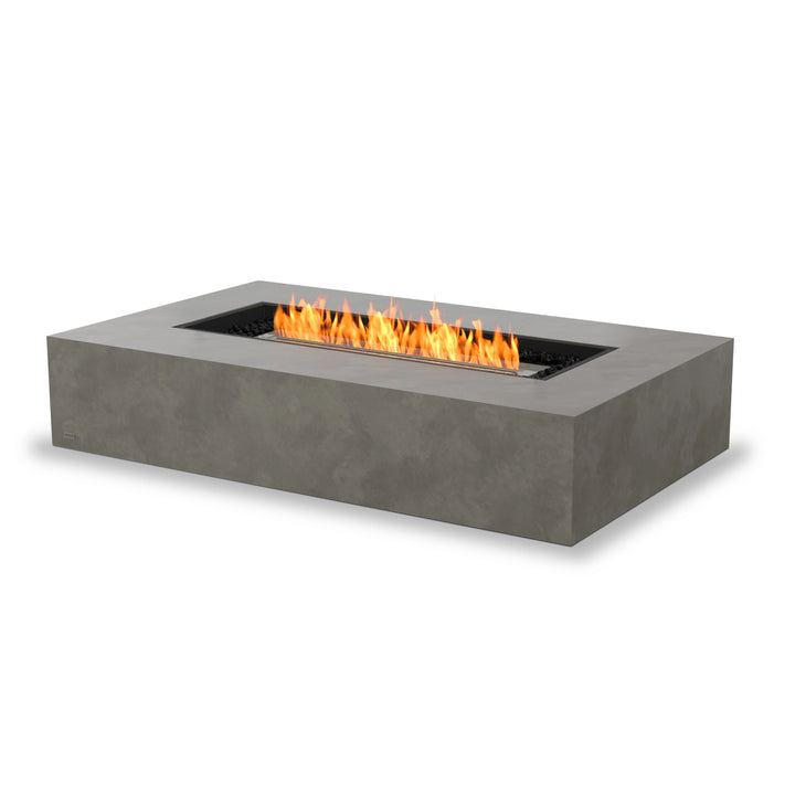 EcoSmart Fire Wharf 50 fire pit in a natural concrete finish with a stainless steel burner, featuring a large rectangular fire table design. This elegant outdoor fire pit is perfect for modern patios, offering a sophisticated gas fire pit experience for backyard entertaining.