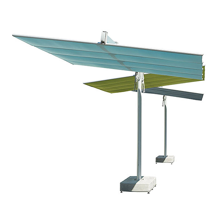 Side-angle view of the FIM Umbrellas Flexy Twin 8x17' Rectangular Dual Shade Umbrella. This angle highlights the structure and design of the dual canopies extending from a central support post, offering an elegant and functional solution for large patio spaces. Suitable for residential and commercial use.