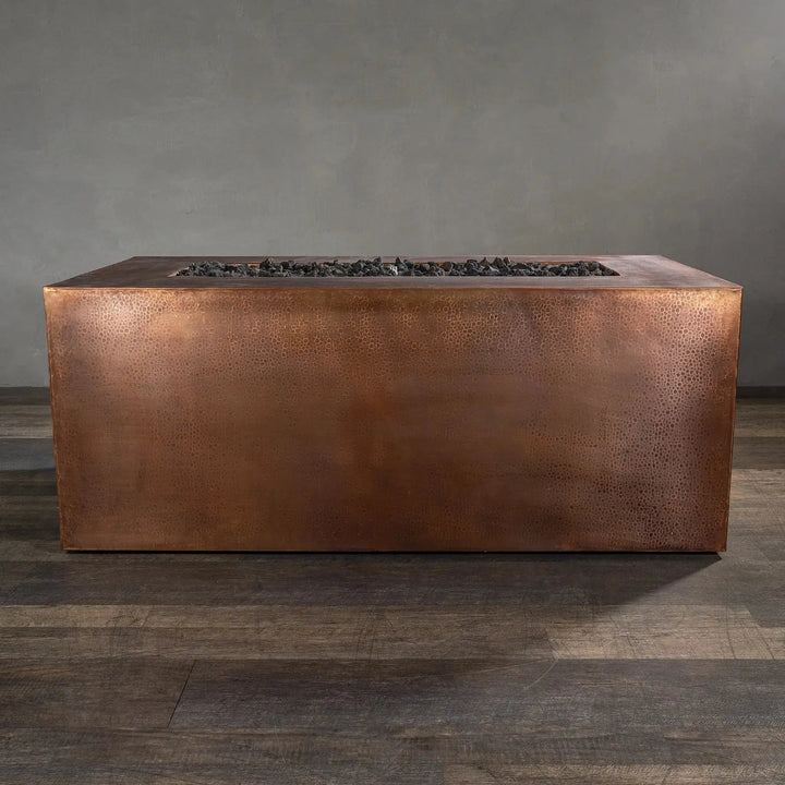 Back view of the Gravity Moreno 60x32 rectangular copper fire pit by Starfire Designs, showcasing the detailed copper texture and sleek design