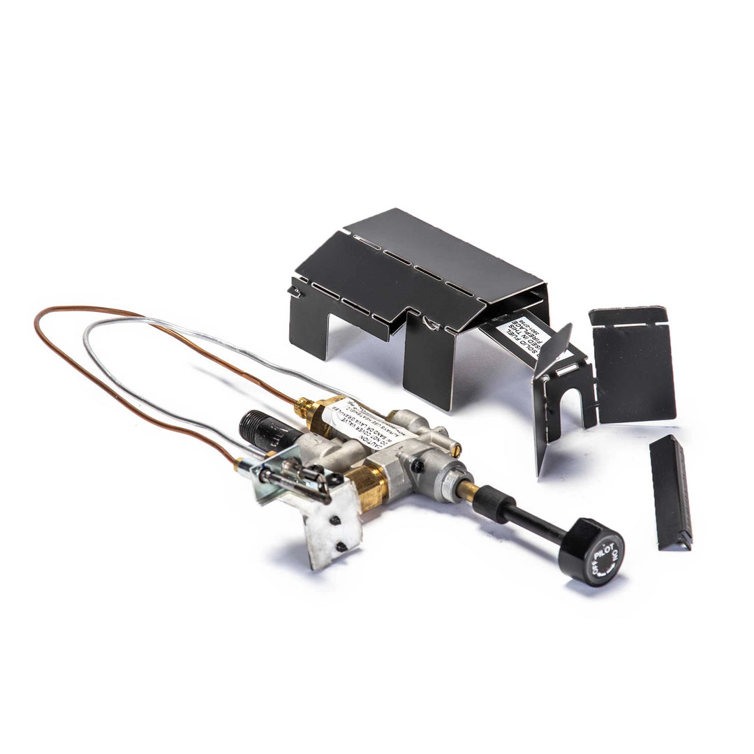 Disassembled Real Fyre low-profile safety pilot kit showing gas valve, thermocouple, and protective cover. Ideal for fireplaces requiring reliable and compact safety pilot systems