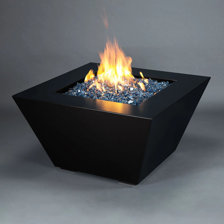 Angled view of the Mill 40-inch Square Steel Gas Fire Pit - Black Hammertone, highlighting the sleek design and bright flames. Perfect for contemporary outdoor spaces