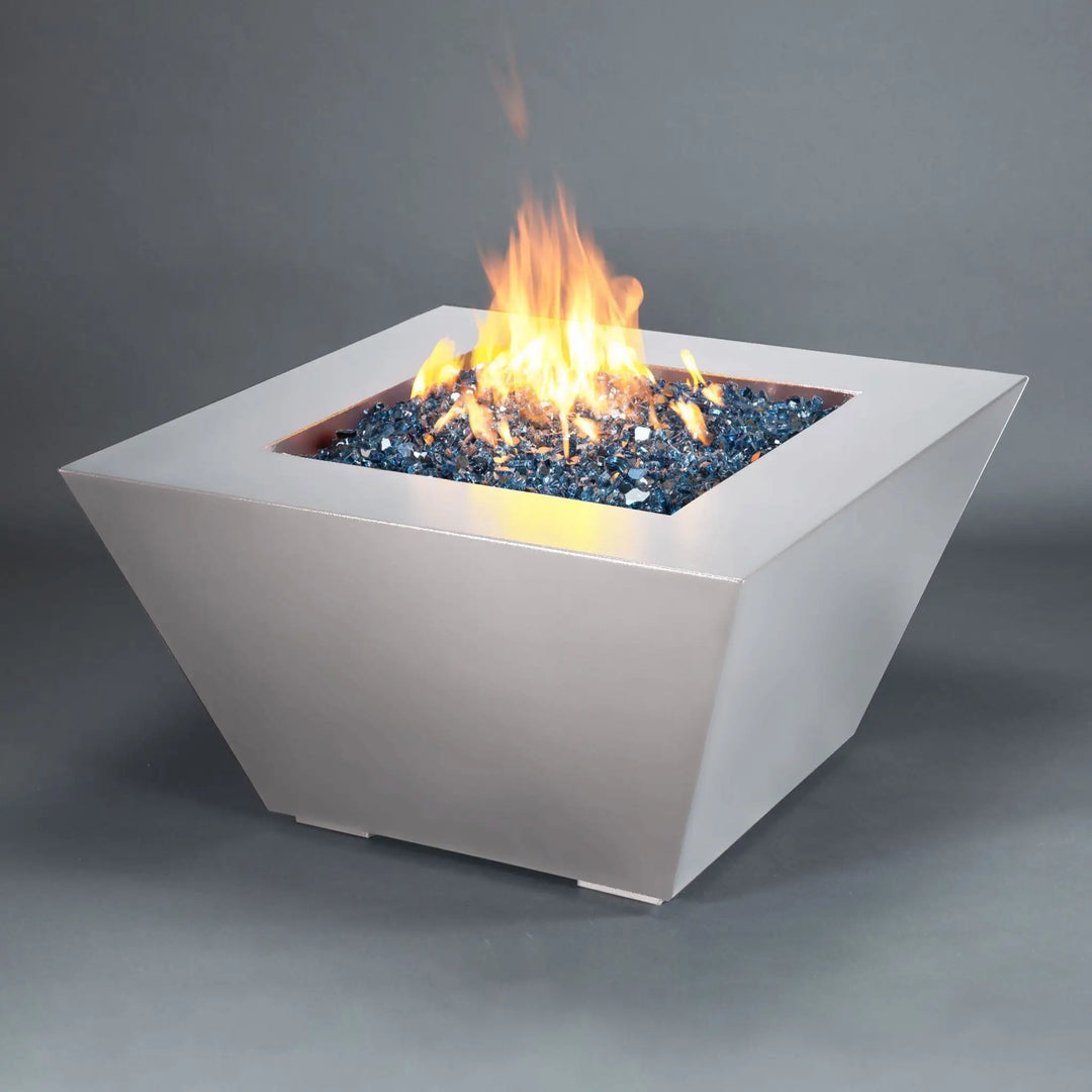 Angled view of the Mill 40-inch Square Steel Gas Fire Pit - White Hammertone with a bright flame. This modern fire pit is perfect for creating a warm, inviting outdoor space