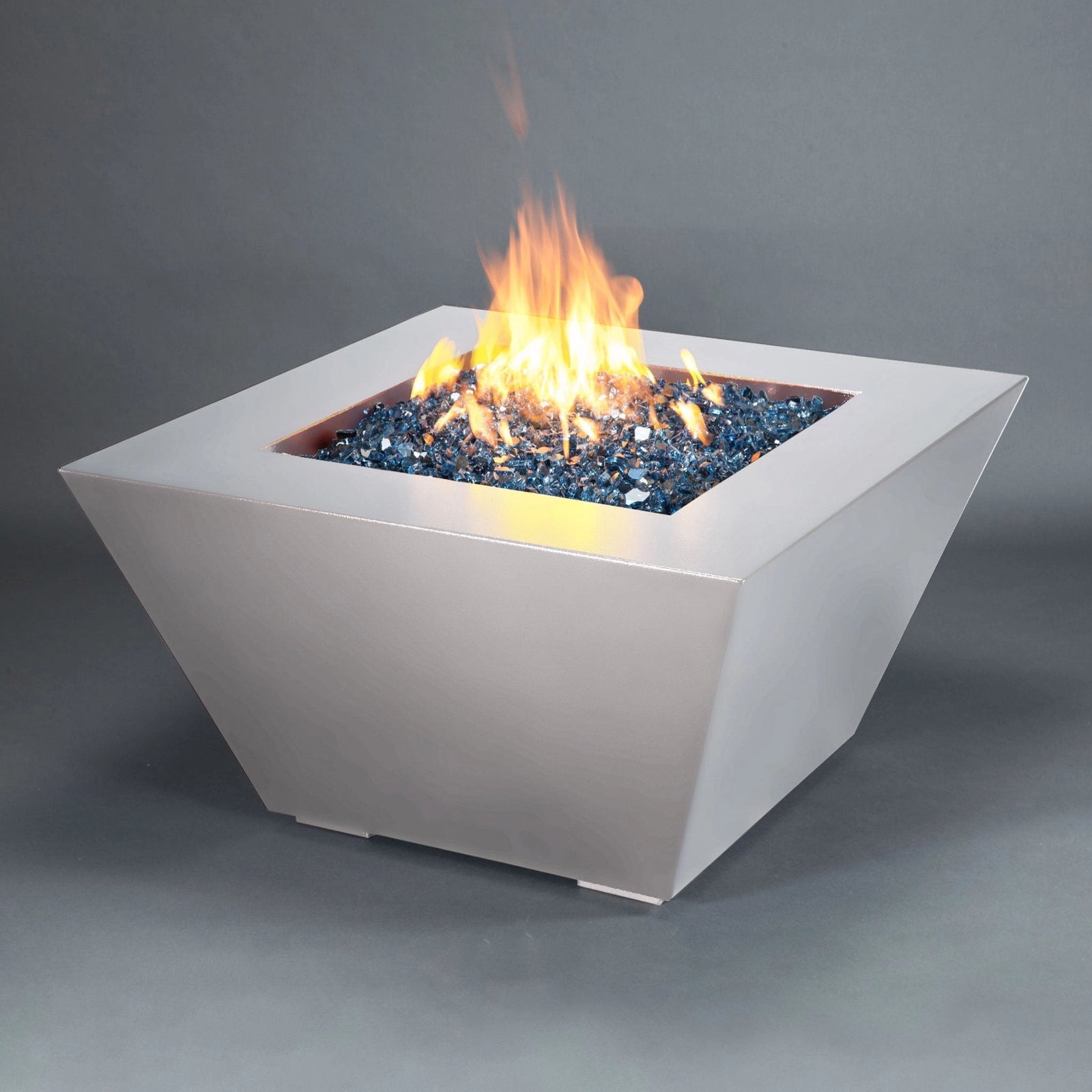 ontemporary square metallic fire pit with blue fire glass and vibrant flames, ideal for modern outdoor setting