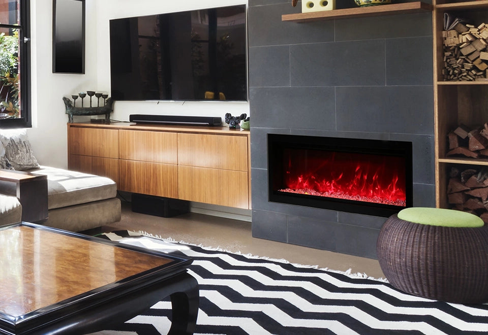 Contemporary ventless electric fireplace with a vibrant red flame display, set in a sleek black tile living room wall. The modern design enhances indoor spaces with warmth and ambiance, offering a safe and stylish heating solution for residential interiors.