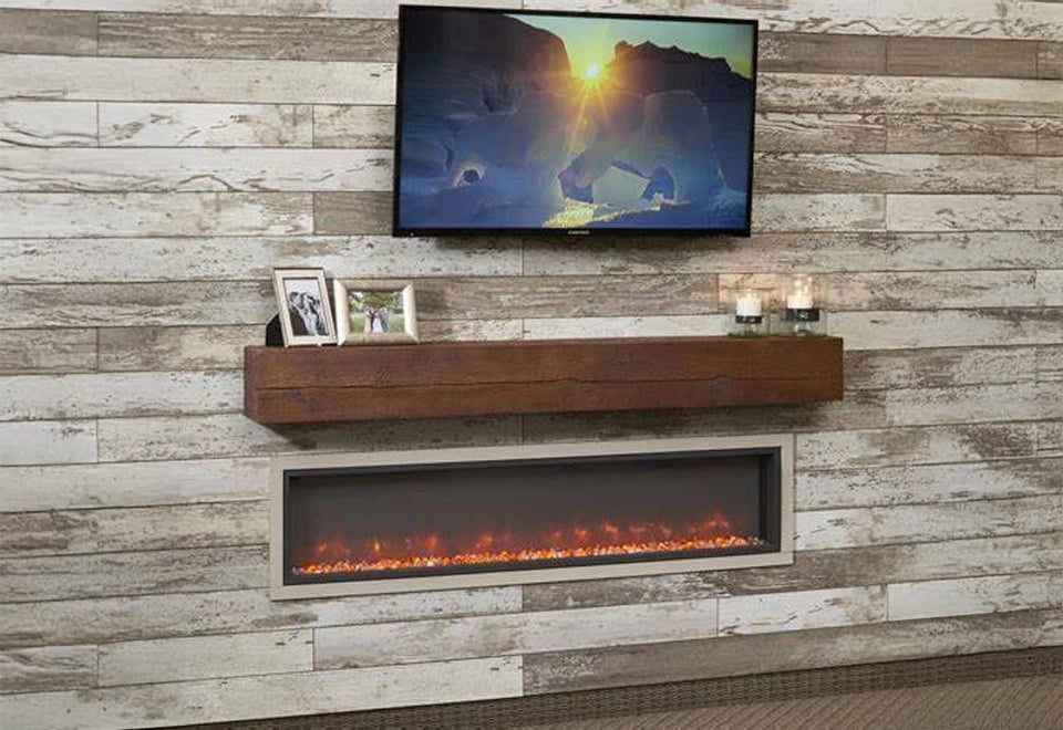 Contemporary linear electric fireplace with a rustic wooden mantel and decorative accents, set against a weathered wood plank wall under a mounted TV.