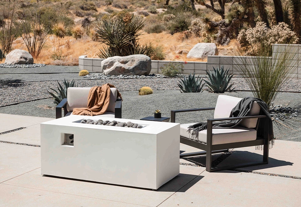 Sleek modern white rectangle gas fire pit with hidden propane tank design, featuring smooth concrete finish and lava rock accents, perfect for outdoor patio fire pit settings.