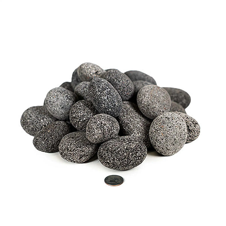 A close-up view of medium-sized (2-3 inches) rolled lava rocks, suitable for outdoor fire pits and fireplaces. These high-quality volcanic rocks offer superior heat retention, ensuring an even and efficient burn. The pile of lava rocks showcases their natural texture and dark gray tone, which adds a stylish and functional element to outdoor fire features