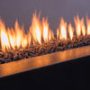 Detailed close-up of small volcanic lava rocks for fire pits, emphasizing their porous and rugged texture. These heat-resistant lava stones are excellent for both gas and wood-burning fire features, providing a natural aesthetic and optimal heat retention for enhanced outdoor fire pit performance.