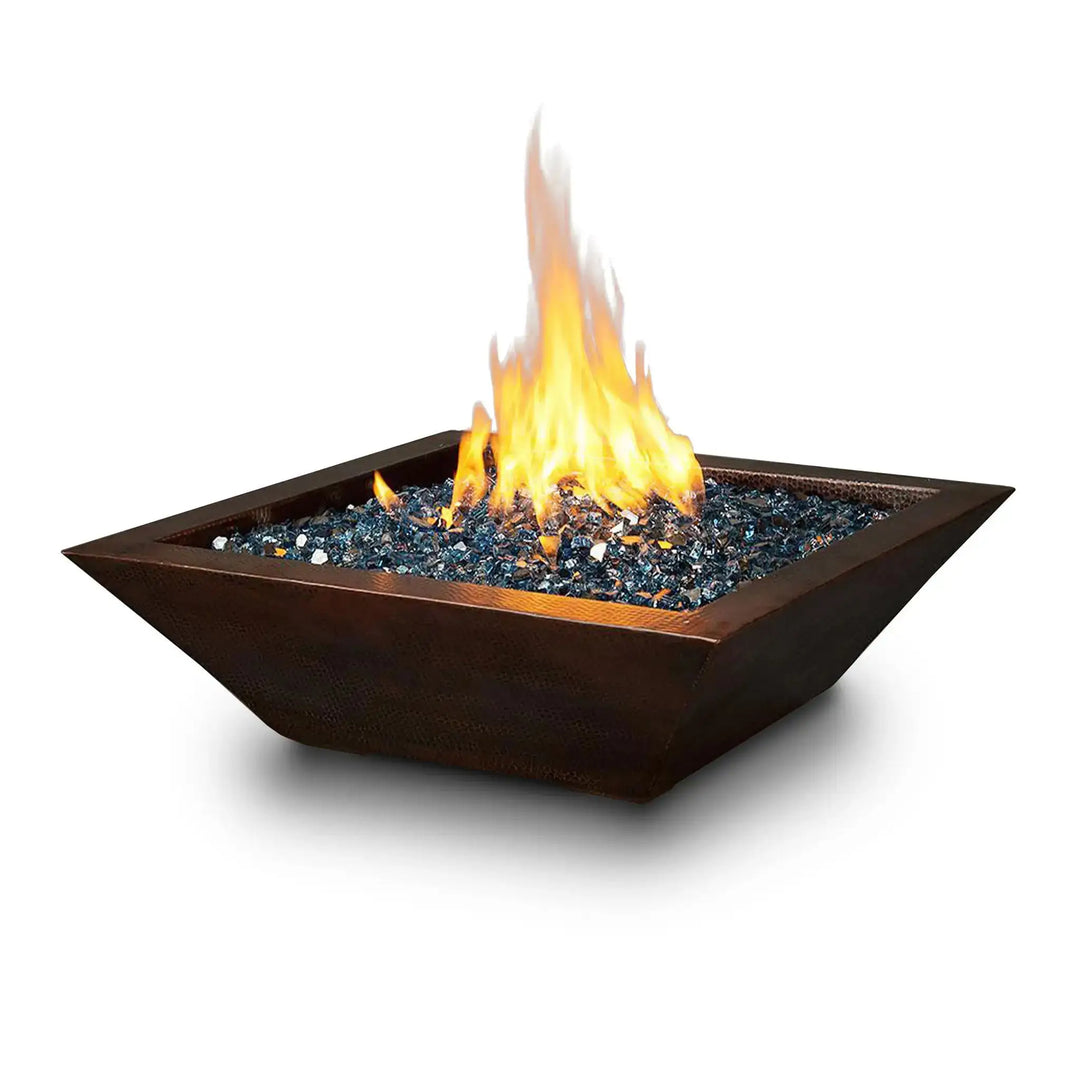 Plaza Moreno 29-inch square copper fire bowl with a modern design, featuring a vibrant natural gas flame and blue fire glass, perfect for outdoor patios