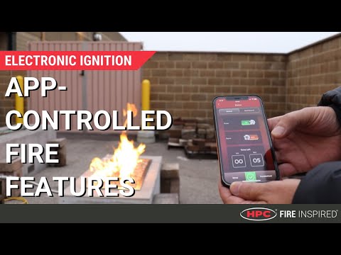 YouTube video thumbnail showing an app-controlled fire pit demonstration by HPC Fire Inspired, featuring smartphone and tablet controls that adjust flame height and ignition settings for a modern outdoor fire experience.