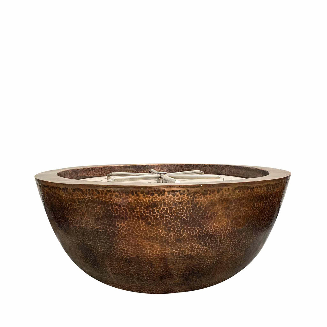 A studio shot of the Prism Hardscapes 39" Edel Hospitality Moderno 1 Copper Fire Bowl, isolated on a white background, highlighting the handcrafted hammered copper construction and robust design. Ideal for use in outdoor spaces like patios and gardens, this fire bowl is both practical and luxurious. 