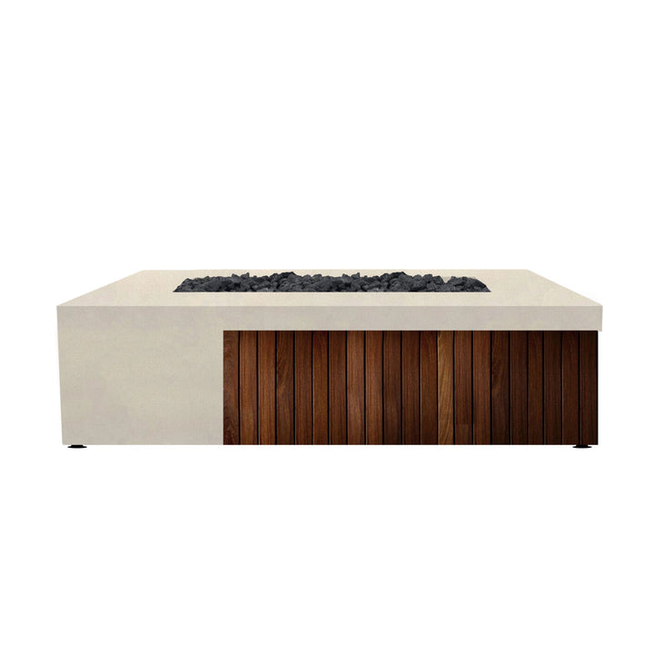 Prism Hardscapes Fairmont Fire Table in coastal white concrete with natural wood paneling, providing a clean and elegant fire pit for outdoor spaces. The rectangular design is accentuated with dark lava rocks, offering a sophisticated addition to modern patio settings.