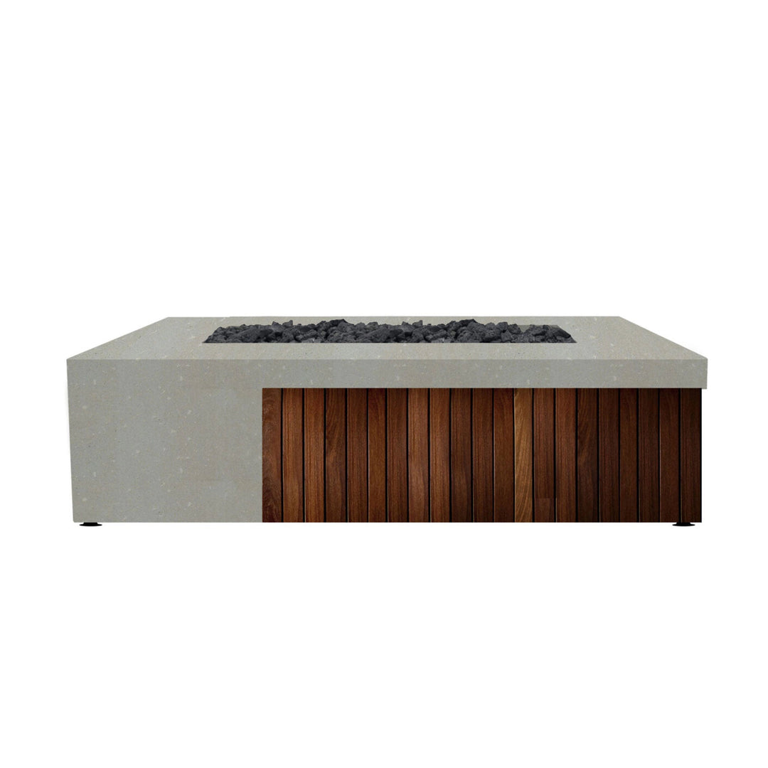 Prism Hardscapes Fairmont Fire Table in natural gray concrete with wooden panels. Its sleek, minimalist design makes it ideal for outdoor patios or backyard fire pit settings, blending seamlessly into modern or rustic décor. 