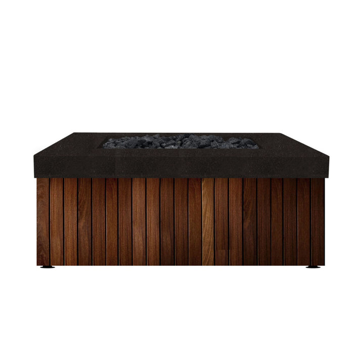 The Prism Hardscapes Manchester Fire Table in an elegant ebony finish provides a bold contrast between its dark concrete top and natural wood base. This modern fire table is a perfect fit for sophisticated outdoor spaces, blending the warm texture of wood with the sleek, dark concrete for an upscale backyard fire pit design. Ideal for patios, this fire pit combines luxury and functionality, making it a must-have outdoor gas fire pit for those looking to elevate their outdoor living area.