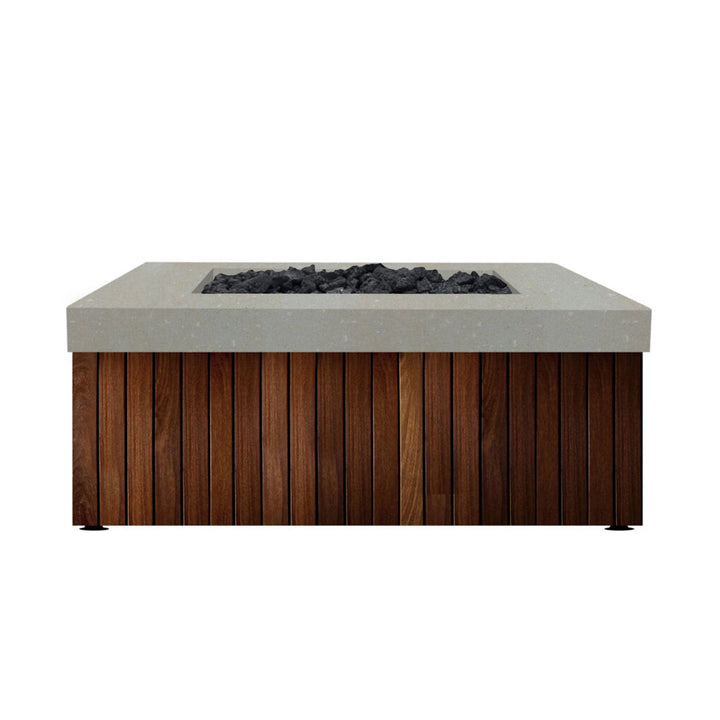 The Prism Hardscapes Manchester Fire Table in a natural finish features a textured concrete top paired with a wood panel base, creating an organic, earthy look. This fire table's neutral color palette makes it a versatile option for various outdoor settings, seamlessly blending into natural surroundings while providing a cozy focal point for outdoor fire pit areas. The natural finish emphasizes the raw beauty of the materials, making it ideal for creating an inviting fire pit for your backyard or patio.