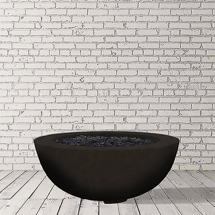 Prism Hardscapes Moderno 8 Gas Fire Bowl in Ebony finish, offering a bold and dark aesthetic with a perfectly rounded shape. This modern outdoor fire pit creates a striking contrast in any backyard or patio space, perfect for natural gas or propane-fueled flames. Enhance your outdoor living area with this sleek gas fire pit.