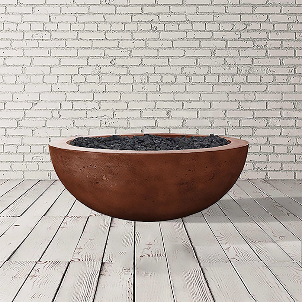 The Prism Hardscapes Moderno 4 Gas Fire Bowl in Cafe finish is shown in a studio setting with its smooth, round shape made of durable concrete. This outdoor gas fire pit features a rustic brown hue, perfect for adding warmth and charm to any backyard or patio. The fire bowl is designed for both propane and natural gas, making it a versatile addition to outdoor fire pits collections. Key elements include its sturdy construction, spacious bowl design, and compatibility with black lava rock or fire glass.