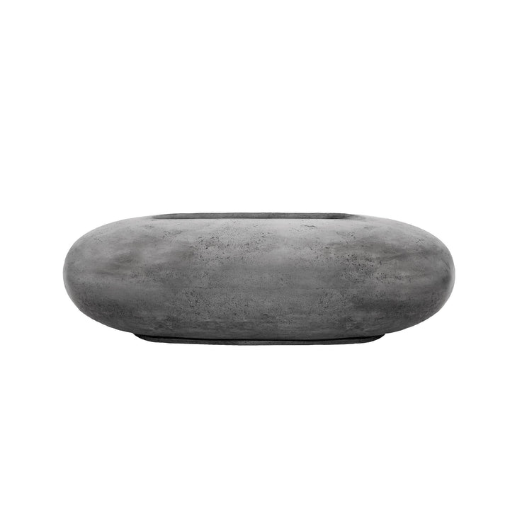 The Prism Hardscapes Pebble Gas Fire Pit in pewter offers a sleek, modern design in a sophisticated gray tone. Its rounded, smooth oval shape is ideal for outdoor patio setups, providing a stylish and functional centerpiece for fire pit enthusiasts.