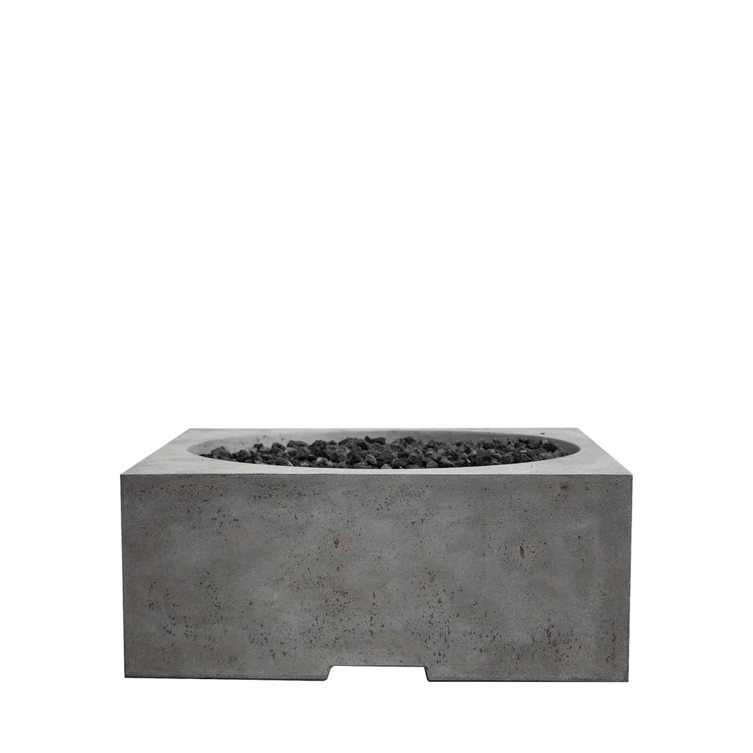 The Prism Hardscapes Piazza Gas Fire Pit in Pewter finish offers a chic, industrial-inspired look with its rectangular concrete body. Ideal for outdoor fire pits, this fire pit is built from sturdy materials for long-lasting use and includes black lava rocks to enhance its natural gas-powered flames. Perfect for creating a focal point in commercial or residential outdoor spaces.