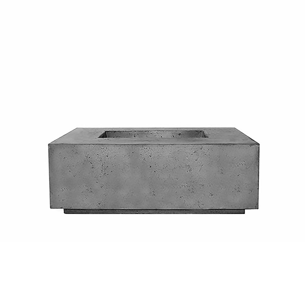  The Prism Hardscapes Portos 58" Propane Fire Table in a cool pewter finish is displayed in a cozy outdoor seating area. The sleek, minimalist design and solid construction make this fire table a great addition to modern outdoor spaces. Crafted from concrete, this table is designed for durability and style, perfect for large backyard fire pit gatherings or as an elegant addition to outdoor patio furniture.