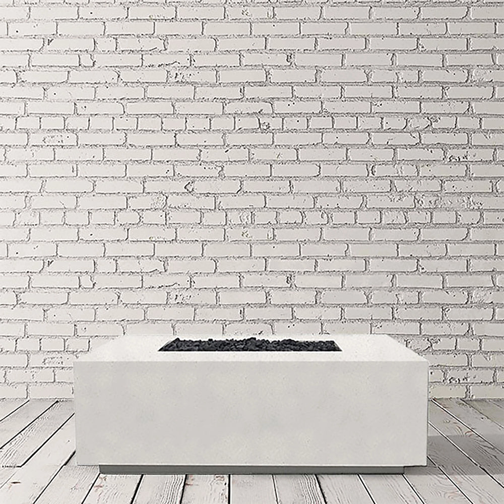 A pristine studio image of the Prism Hardscapes Portos 58" Propane Fire Table in ultra-white. This bright and minimalist design brings a modern touch to any outdoor fire pit space. Constructed from concrete with a smooth surface, it is both durable and stylish, making it ideal for commercial fire pit installations or luxury backyard fire pits. The ultra-white finish provides a clean and elegant look for any patio fire pit area.