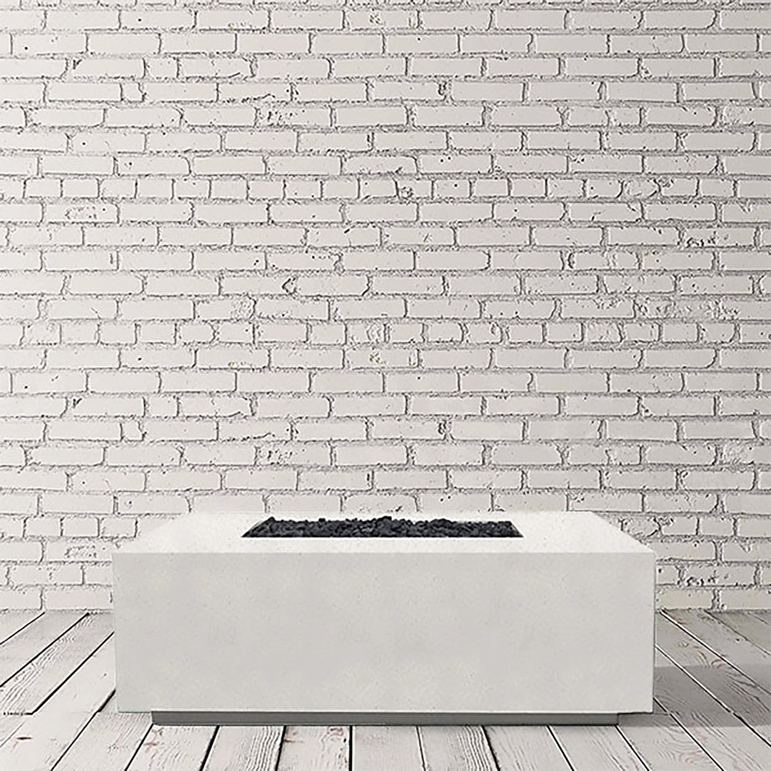 A pristine studio image of the Prism Hardscapes Portos 58" Propane Fire Table in ultra-white. This bright and minimalist design brings a modern touch to any outdoor fire pit space. Constructed from concrete with a smooth surface, it is both durable and stylish, making it ideal for commercial fire pit installations or luxury backyard fire pits. The ultra-white finish provides a clean and elegant look for any patio fire pit area.