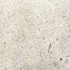 Close-up swatch of the Prism Hardscapes Tavola 1 Gas Fire Pit in a natural gray color, featuring a lightly speckled, weathered texture. This versatile and timeless shade is perfect for outdoor fire pits, enhancing any backyard or patio space with a modern yet rustic look. Ideal for fire pit tables and concrete fire pits