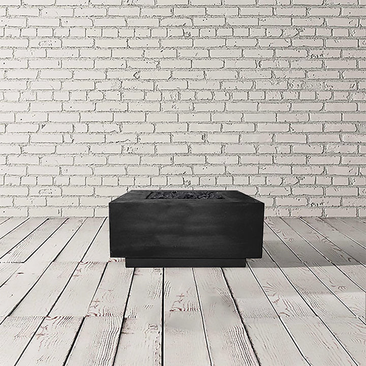 Prism Hardscapes Tavola 2 Gas Fire Pit in a sleek ebony color, delivering a modern and stylish touch to your outdoor fire pit space. This concrete fire pit is perfect for contemporary backyard designs, with a minimalist structure and an elegant black finish. Designed for both propane and natural gas use, this durable fire pit enhances large fire pits, modern gas fire pits, and outdoor fire table aesthetics.