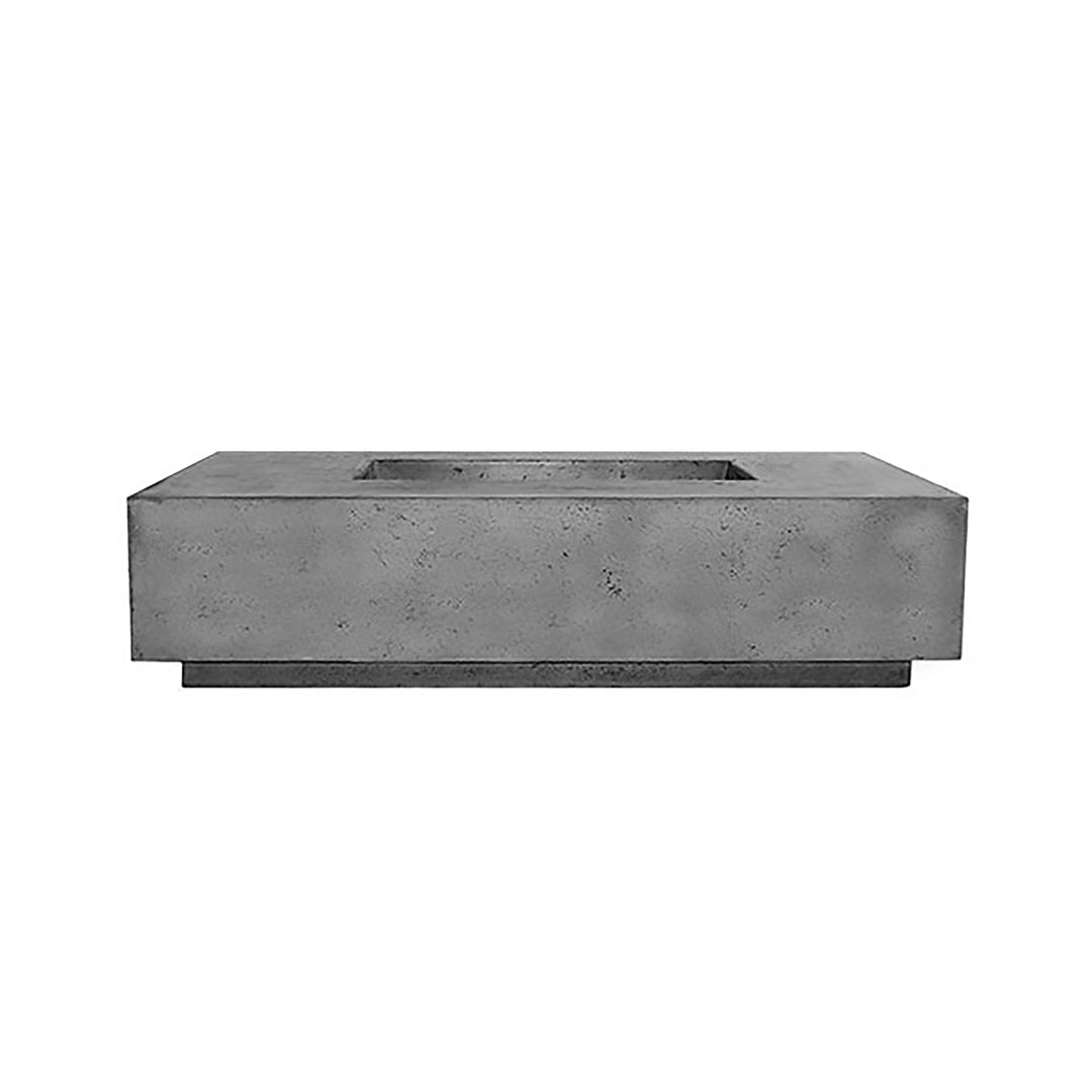 The Prism Hardscapes Tavola 4 gas fire pit in pewter, showing off its refined, minimalist design. The concrete finish in pewter offers a neutral, sophisticated look that complements various outdoor decors. This gas fire pit is a practical addition for patios, enhancing backyard aesthetics while delivering warmth. It operates with natural gas or propane, making it a versatile outdoor fire feature for home use or entertaining.