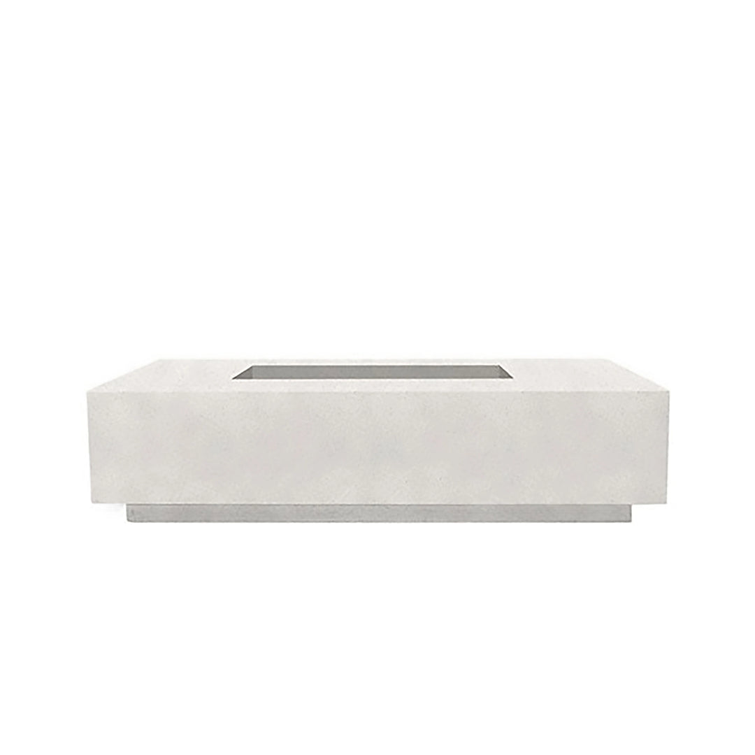 A sleek view of the Prism Hardscapes Tavola 4 gas fire pit in ultra white, emphasizing its crisp, clean lines and minimalist design. Made from durable concrete, this white fire pit is perfect for modern outdoor spaces, creating a striking contrast against natural surroundings. Ideal for contemporary patios, backyard spaces, and outdoor fire pit areas, this fire pit runs on natural gas or propane, delivering both warmth and style.