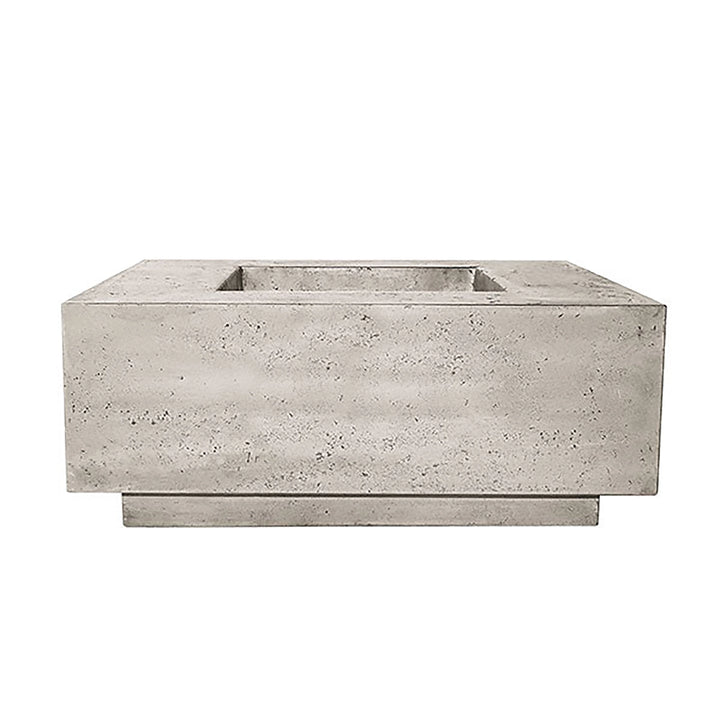 The Prism Hardscapes Tavola 42 Gas Fire Pit in natural gray offers a raw, minimalist design that blends seamlessly into any outdoor decor. The subtle concrete texture gives an industrial vibe, perfect for modern, urban-inspired spaces. This rectangular fire pit is both functional and stylish, providing warmth and ambiance for gatherings on cool evenings