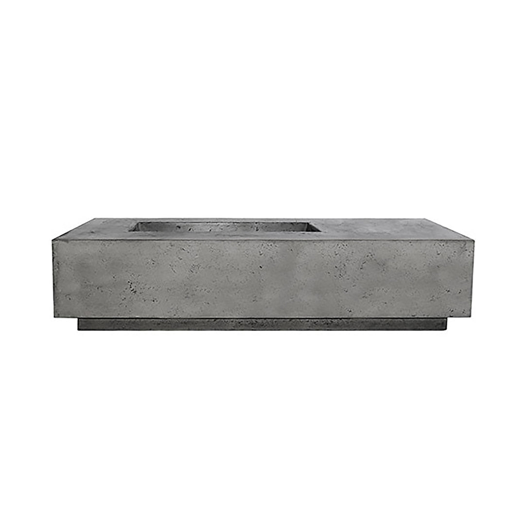 Prism Hardscapes Tavola 5 gas fire pit in a Pewter speckled gray concrete finish. This fire pit showcases a rugged, textured surface that adds depth to outdoor spaces while maintaining a sleek and modern aesthetic. Perfect for adding warmth and ambiance to any backyard or patio setting. 