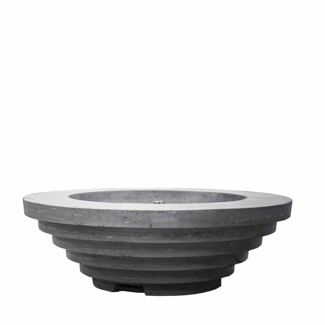 Prism Hardscapes Triton Gas Fire Pit in Pewter, showcasing a clean, modern concrete design with a stepped, tiered profile. The Pewter finish offers a sleek and stylish look, ideal for contemporary or industrial outdoor environments. Suitable for use with natural gas or propane.