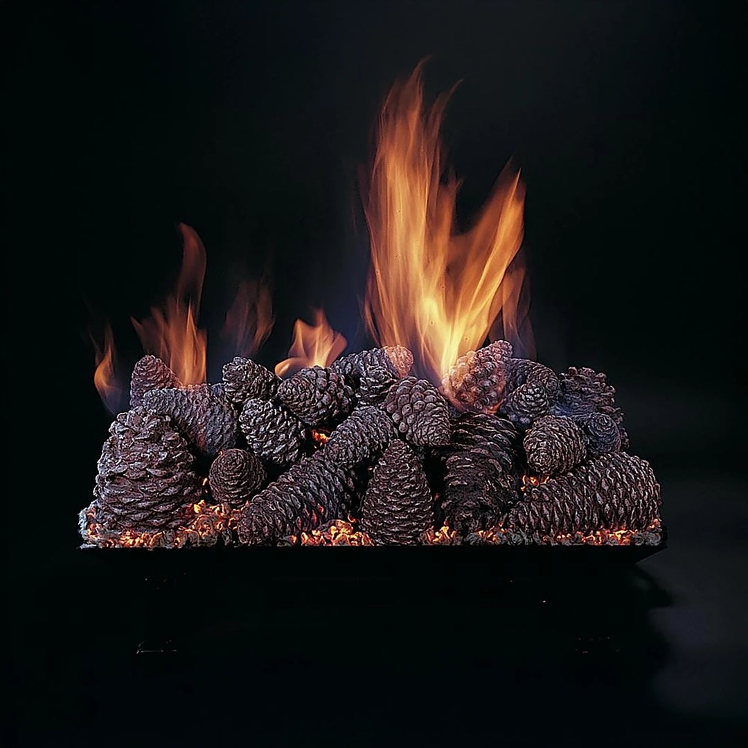 A detailed look at the Rasmussen Large Indoor Vented Custom Pan Burner featuring a large pine cone log set. Flames dance through the pine cones, offering a cozy and nature-inspired aesthetic for any indoor fireplace.