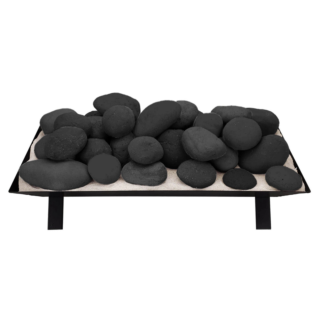 Large stack of black Rasmussen Vented FireStones on a vented tray, ideal for modern outdoor fire pits. These fire stones offer a sleek and striking contrast, enhancing the look and performance of gas fireplaces