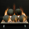 Rasmussen Vented Uniform FireBalls displayed in a fireplace setting with active flames against a dark background. These vented fireballs are made of durable ceramic and are stacked in a pyramid formation, providing a modern, minimalist aesthetic. The fireballs are designed for use in vented gas fireplaces and create a beautiful and warm ambiance, perfect for enhancing indoor and outdoor fire features. The flames elegantly dance around the spherical fireballs, emphasizing their contemporary appeal.