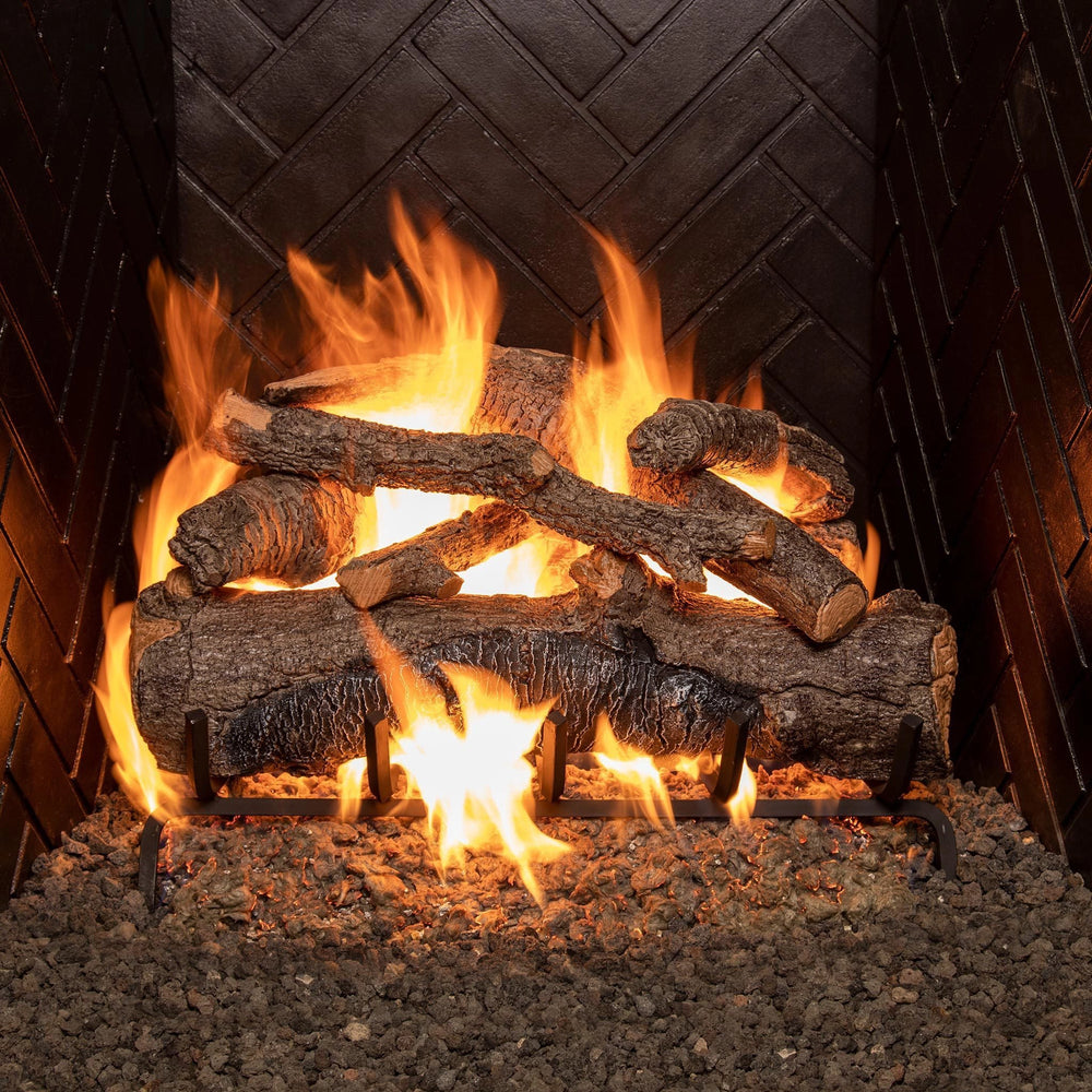 Real Fyre 24-inch Vented American Oak Gas Logs with fire, arranged in a fireplace to display vibrant flames and rich oak textures. Perfect for vented natural gas fireplaces, providing a warm and authentic wood-burning experience.