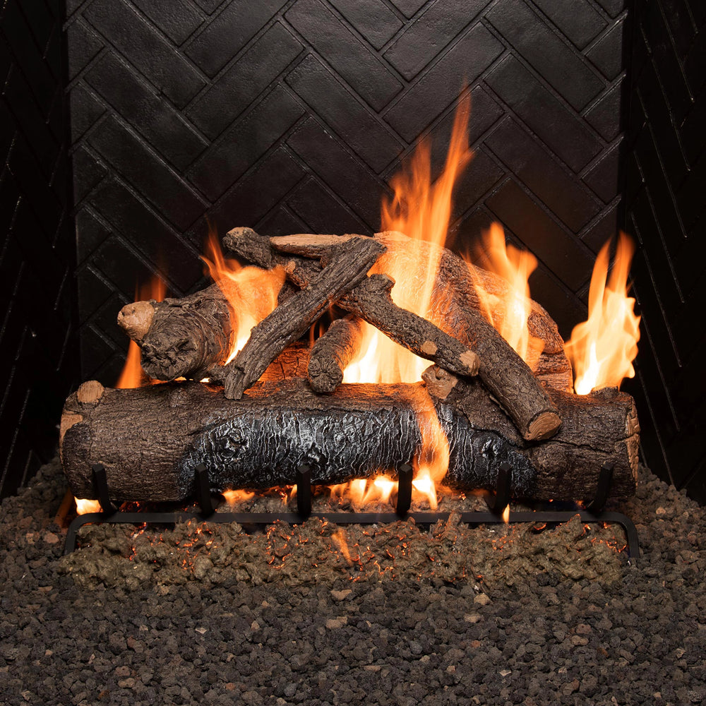 Real Fyre 30-inch Vented American Oak Gas Log Set in a fireplace with flames, creating a cozy and inviting atmosphere. The logs showcase authentic oak wood details and produce a vibrant fire effect, ideal for gas fireplaces seeking a realistic wood-burning experience with vented functionality.