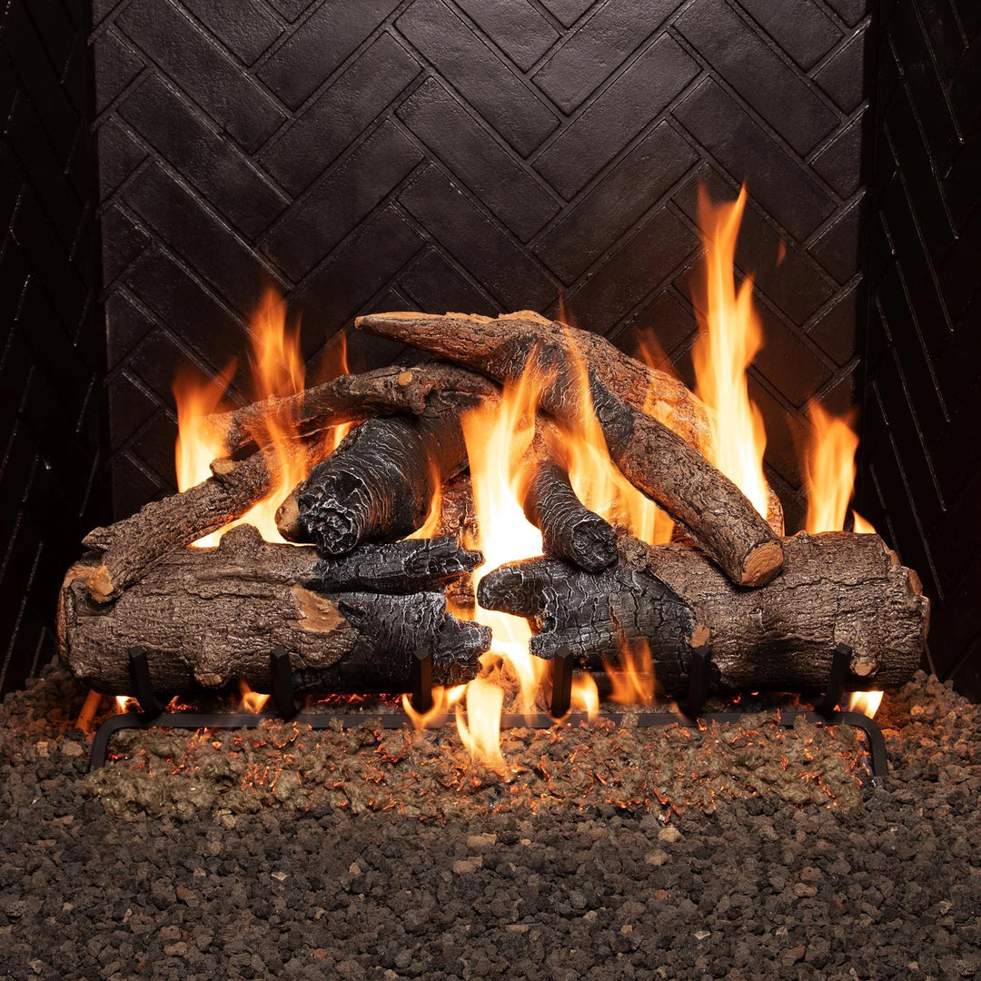 Real Fyre Vented Gas Logs in Charred American Oak, 30-inch set, in a gas fireplace with flames, creating a realistic wood-burning effect with detailed charred and bark-textured logs. Ideal for enhancing the ambiance of indoor gas fireplaces.