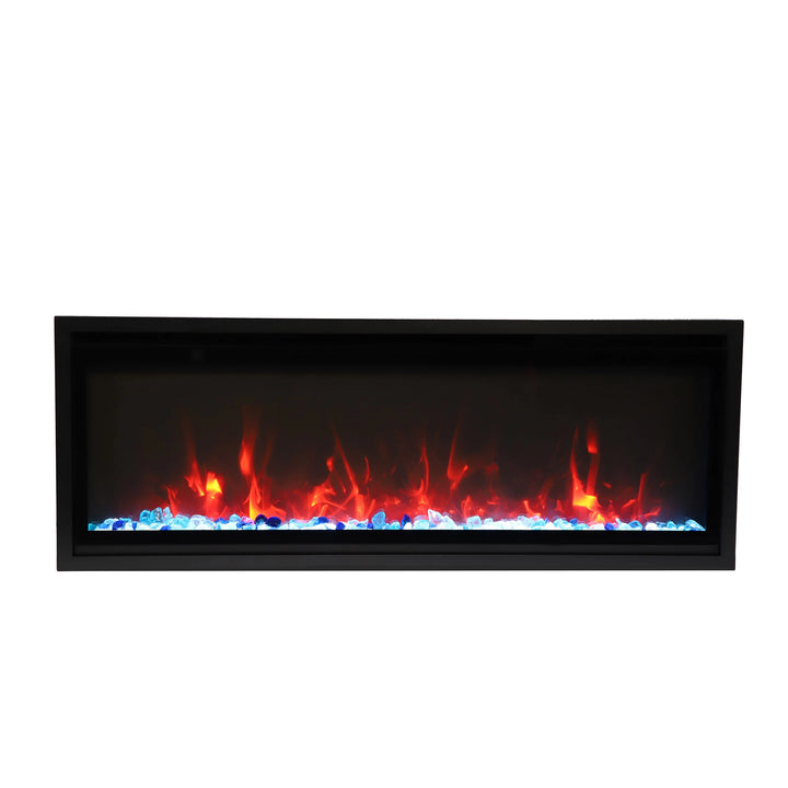 Close-up of the Remii Indoor Extra Slim Electric Fireplace with clear glass media and vibrant multi-color flames in shades of red and blue. The minimalist design and contemporary glass accents add a sophisticated touch, ideal for modern indoor spaces. This electric fireplace highlights an energy-efficient and slim built-in profile.