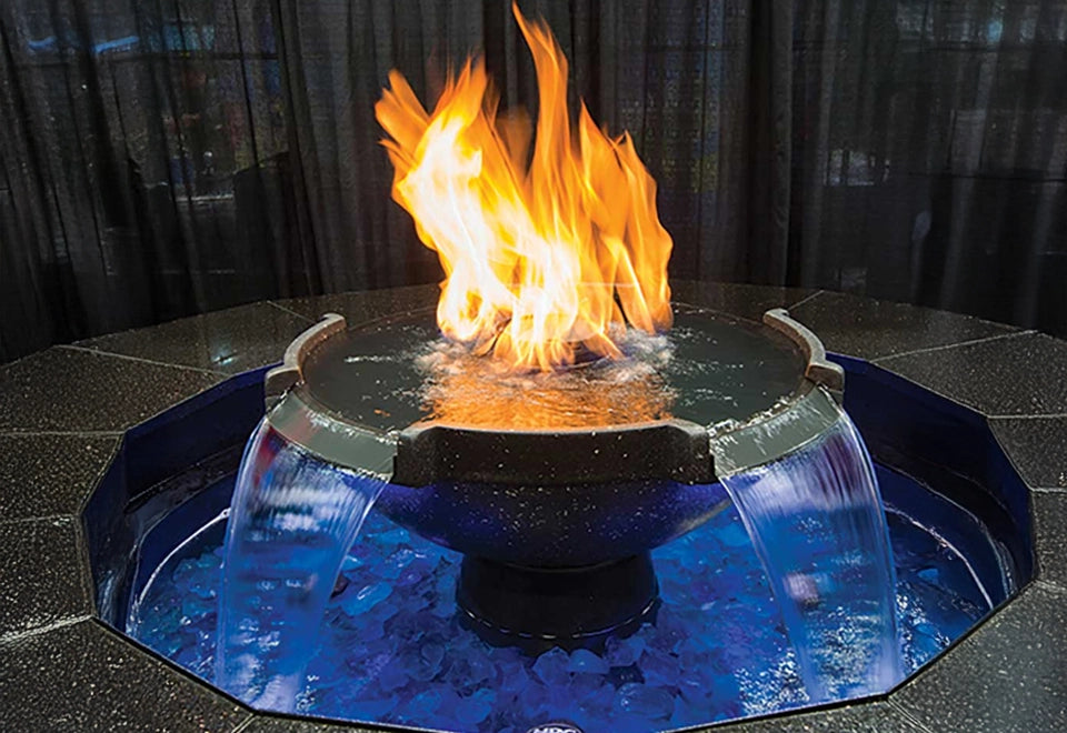 Striking round submersible fire and water bowl with cascading waterfalls and vibrant flames, featuring a unique blend of fire and water elements. Ideal for luxury outdoor designs and creating a captivating ambiance in custom backyard and patio settings.