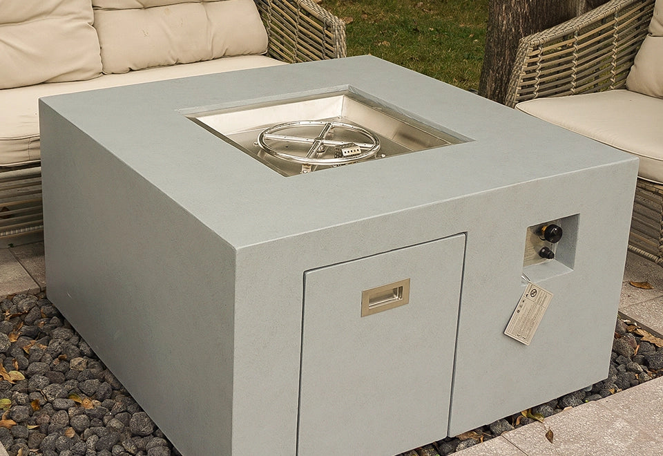 Modern square concrete fire pit with a stainless steel burner kit, designed for outdoor patios and backyard spaces.