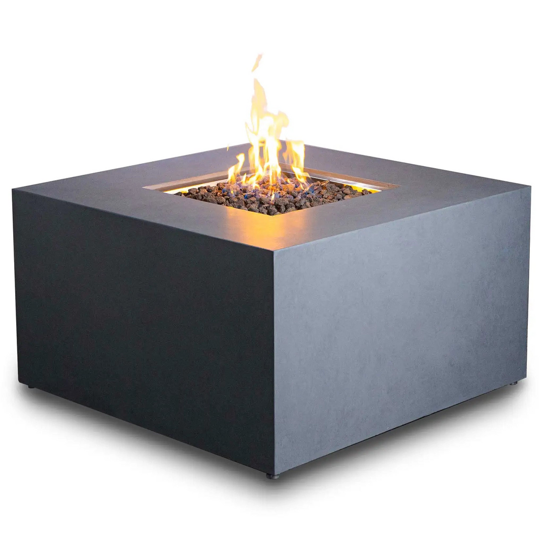 Square concrete fire pit with dark lava rocks and a burning flame, ideal for creating a modern and minimalist outdoor ambiance on patios or backyards