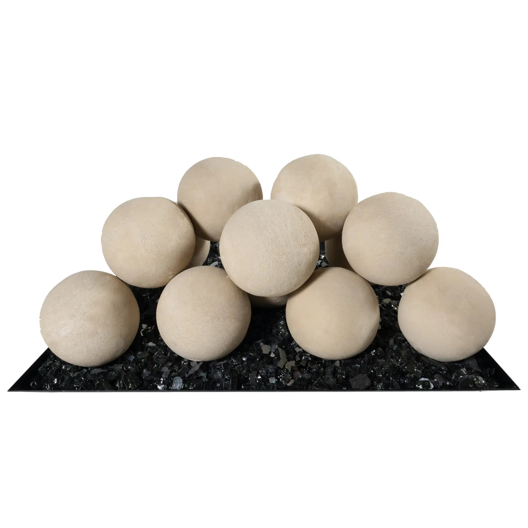 A set of beige Starfire Designs 4-inch ceramic fire balls arranged on fire glass, providing a close-up of the product’s sleek and smooth finish. Perfect for contemporary fire pit designs, these ceramic spheres are heat-resistant and offer a luxurious and modern aesthetic for outdoor fire features