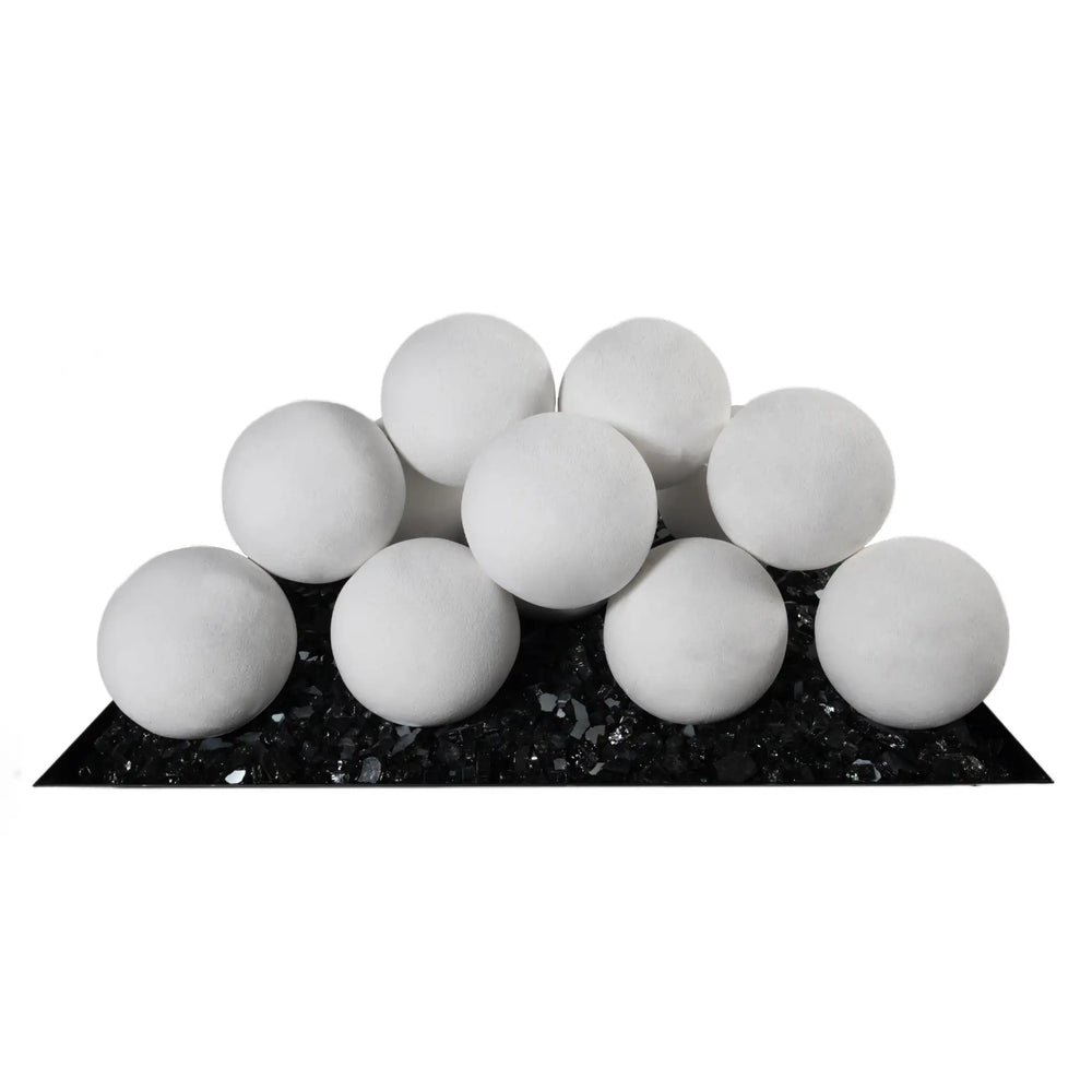 Front view of 12 white 4-inch ceramic fire balls from Starfire Designs, arranged in a pyramid on a black fire glass tray. These durable, heat-resistant ceramic fireballs are designed for use in gas fire pits, providing a sleek and modern alternative to traditional fire media. Suitable for both residential and commercial fire pits, these fireballs are perfect for adding a contemporary touch to any outdoor fire feature. White fire pit accessory, ceramic fireballs, gas fire pit décor