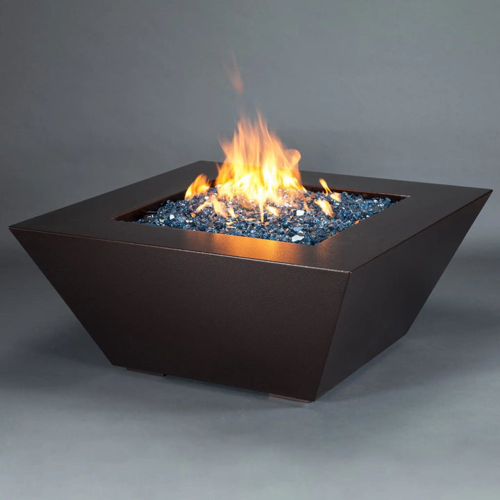 Side view of the Starfire Designs Mill 48-inch square steel gas fire pit in Copper Vein finish, with a strong flame and sleek design, perfect for luxurious patio settings