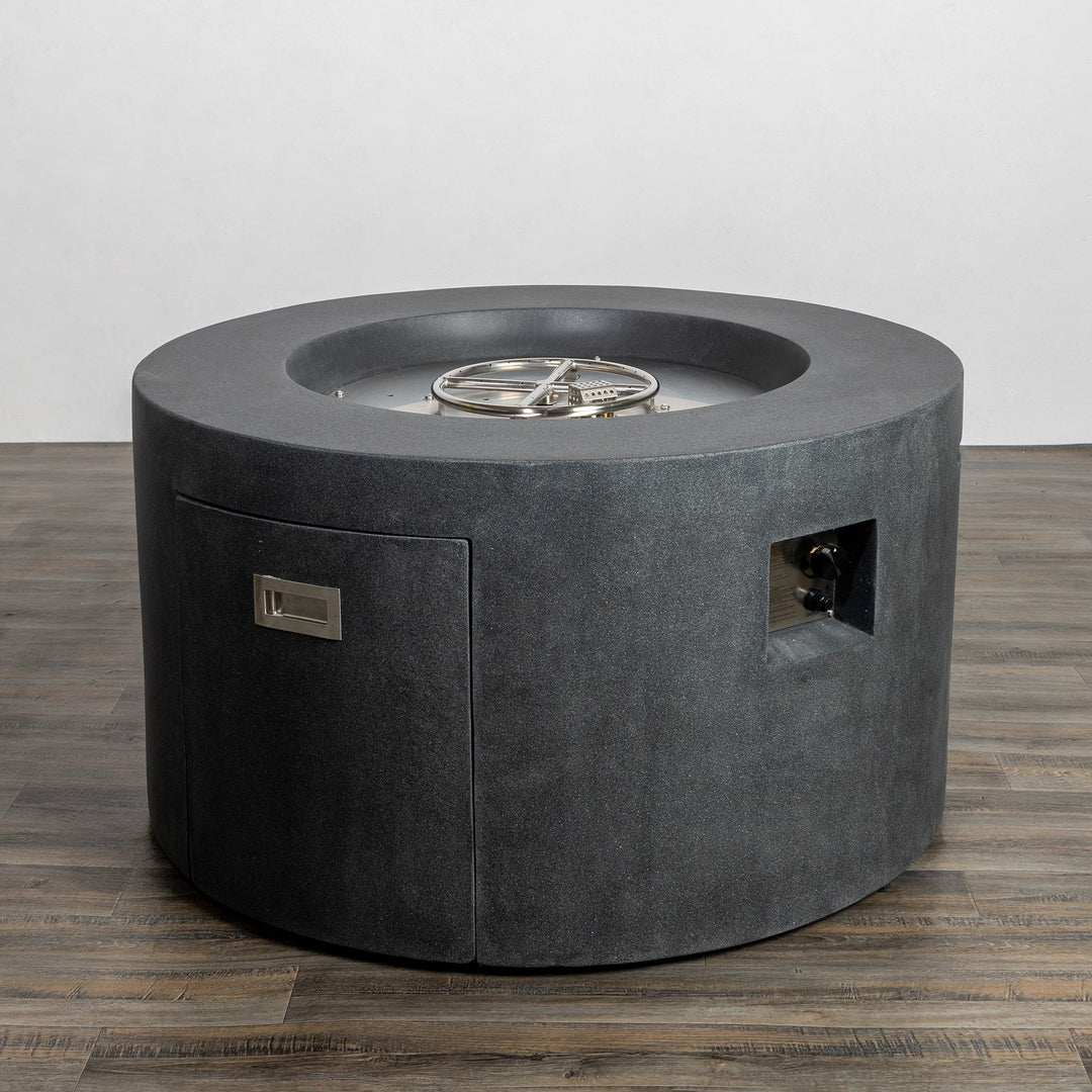 Starfire Designs Beton 42-inch Graphite Round Concrete Gas Fire Pit featuring a fully closed access door with a sleek graphite finish, stainless steel burner, and modern round shape. Perfect for outdoor use with convenient access for storing the propane tank or accessing the ignition system.