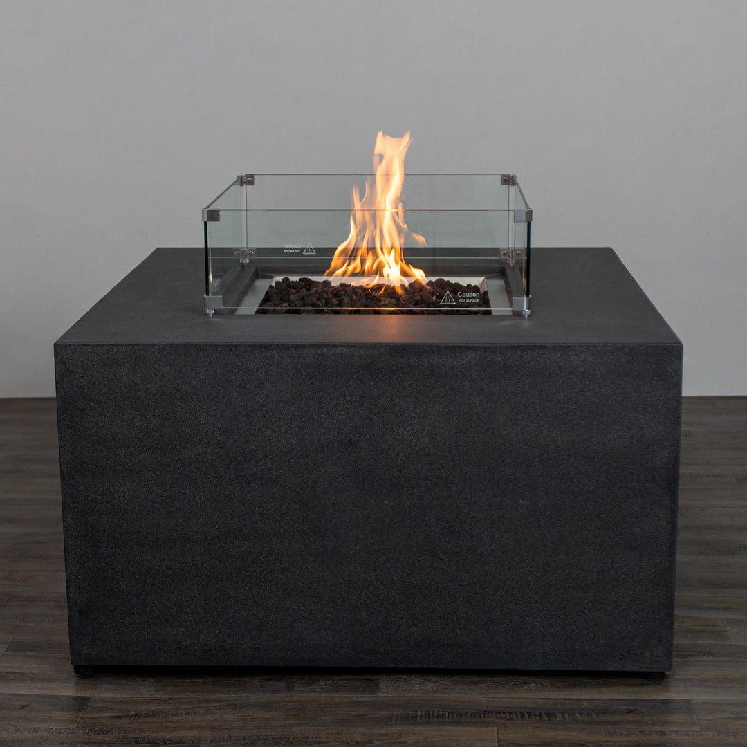 A detailed view of the Starfire Designs Beton 42" Graphite Square Hidden Propane Tank Gas Fire Pit showcasing its elegant graphite finish and vibrant flames. This modern square gas fire pit features a seamless design, ideal for outdoor spaces. 