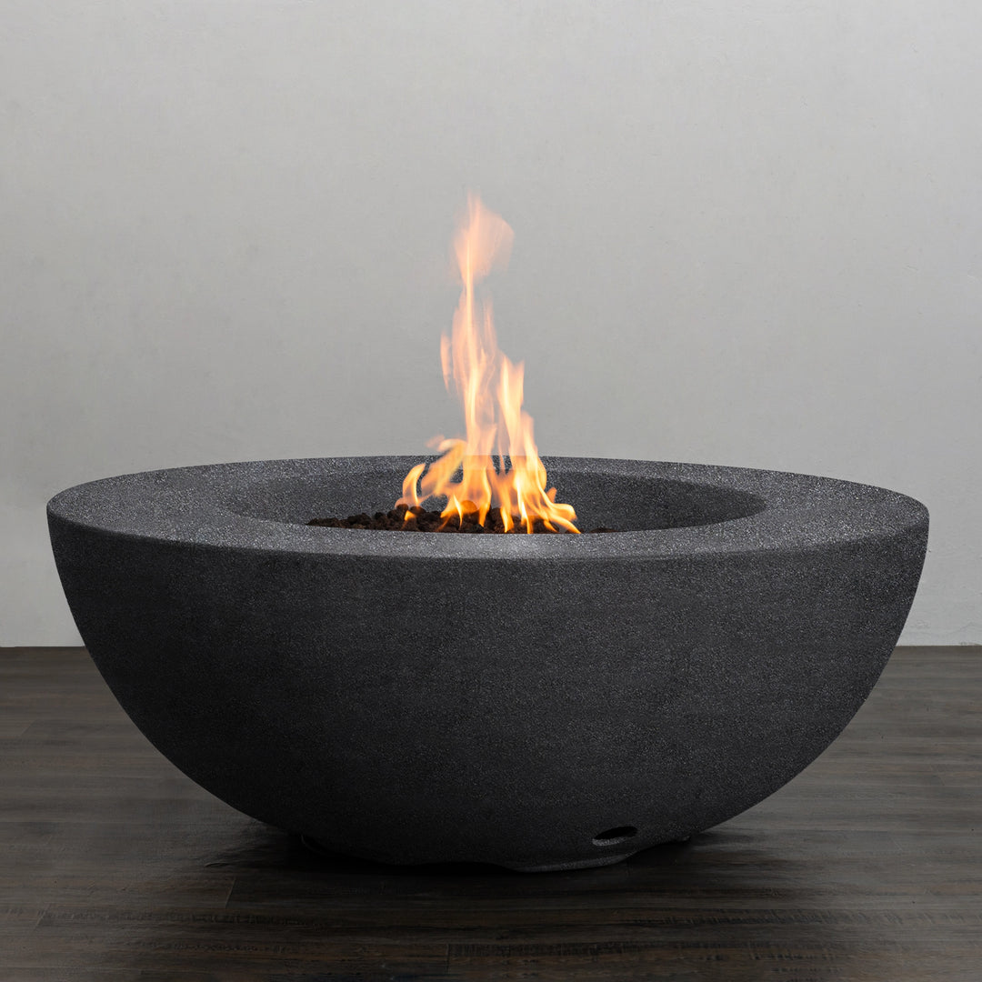 The Starfire Designs Beton 42 Inch Graphite Round Concrete Natural Gas Fire Pit with a radiant flame in full view, highlighting its bold graphite finish, round shape, and clean-burning natural gas performance for a cozy outdoor experience.